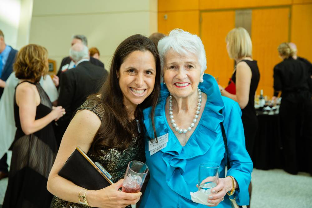 Sylvia Kaufman and guest at the Enrichment Dinner